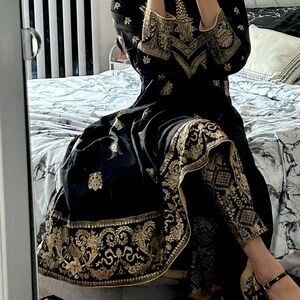 Beautiful traditional black dress with gold details
